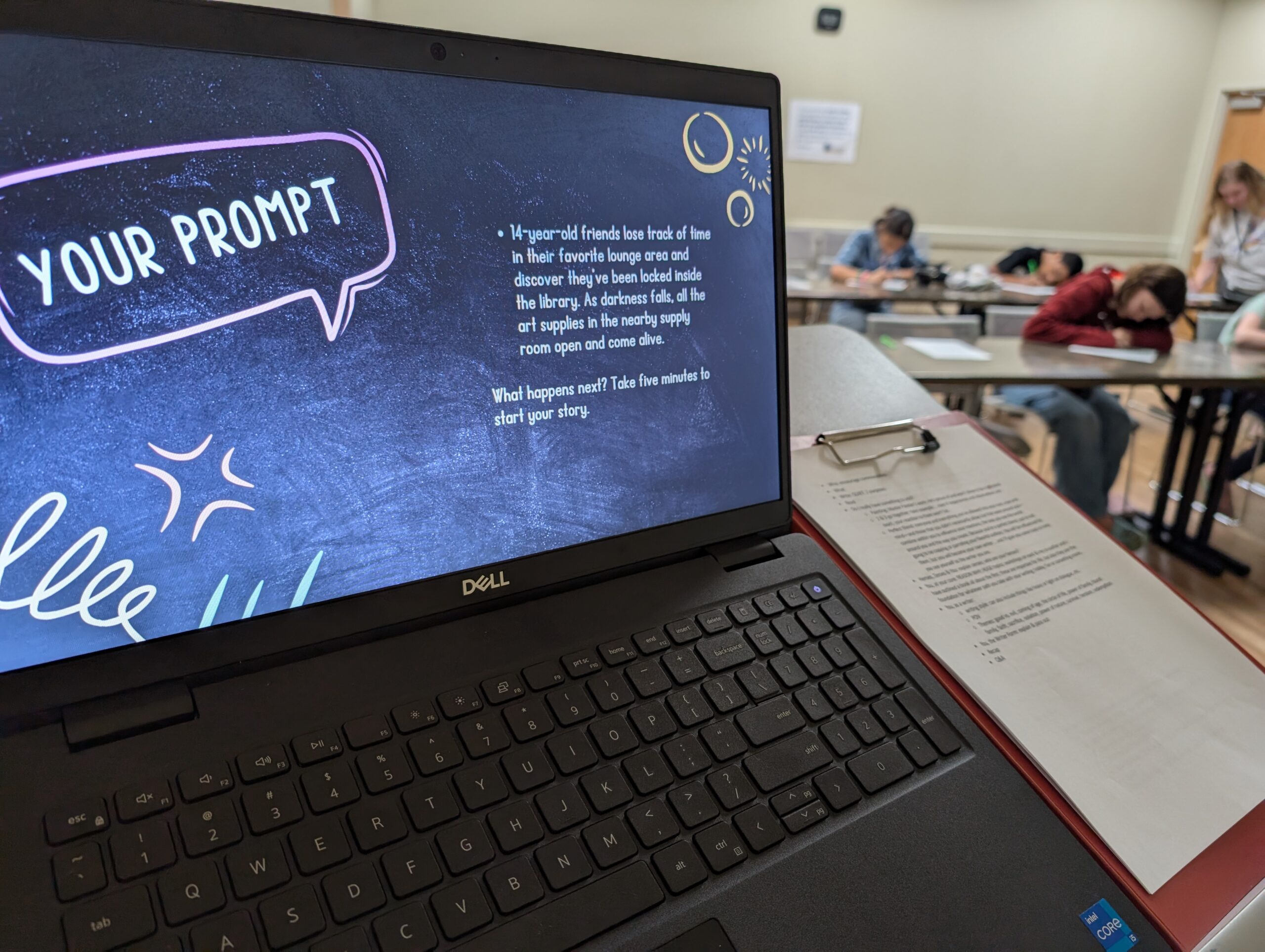 Teens write during a summer reading workshop led by author Joy E. Rancatore.